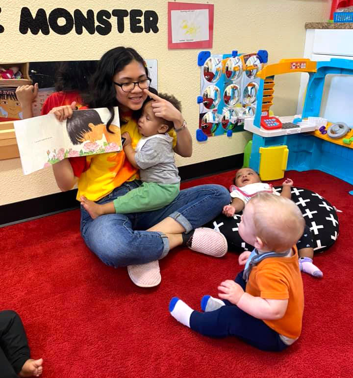 Teacher reading to todlers at Robin's Nest Learning Center in Carbondale, Illinois