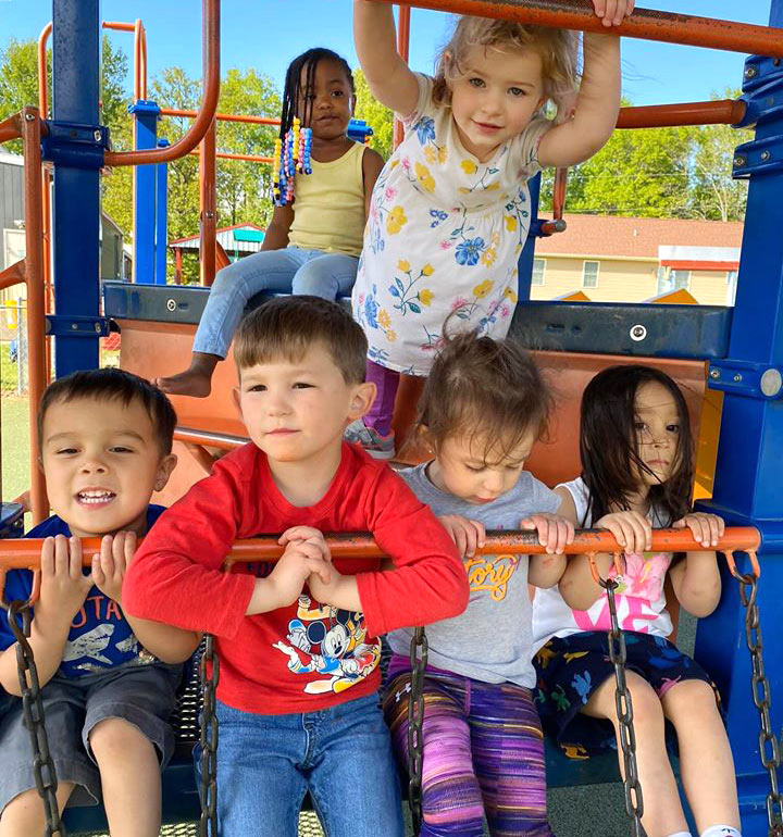 Children playing on jungle gym at Robin's Nest Learning Center in Carterville, Illinois