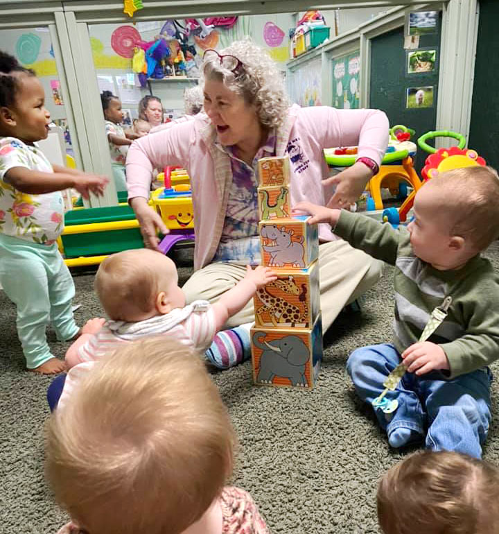 Infants playing with blocks in classroom at Robin's Nest Learning Center in Carterville, Illinois