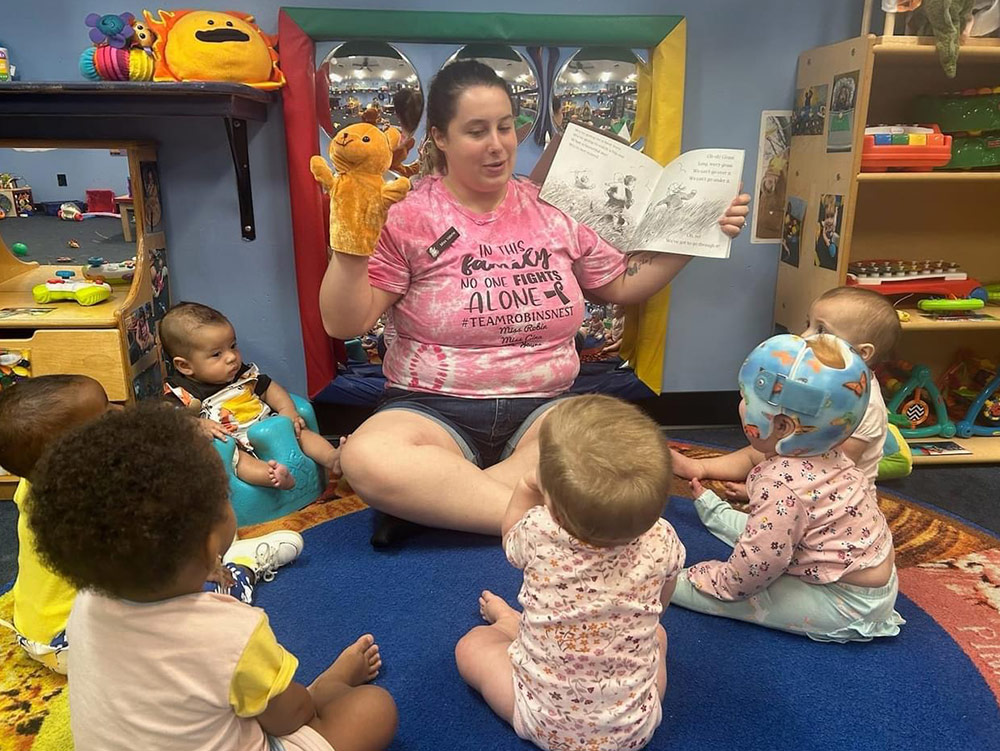 Infant on colorful mat at Robins Nest Learning Center at Robins Nest Learning Center