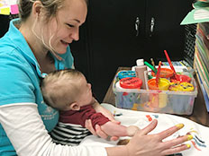 The Brown Bear Room - finger painting at Robins Nest Learning Center