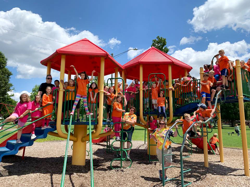 Large group of children on jungle gym at Robin's Nest Learning Center in Marion, Illinois