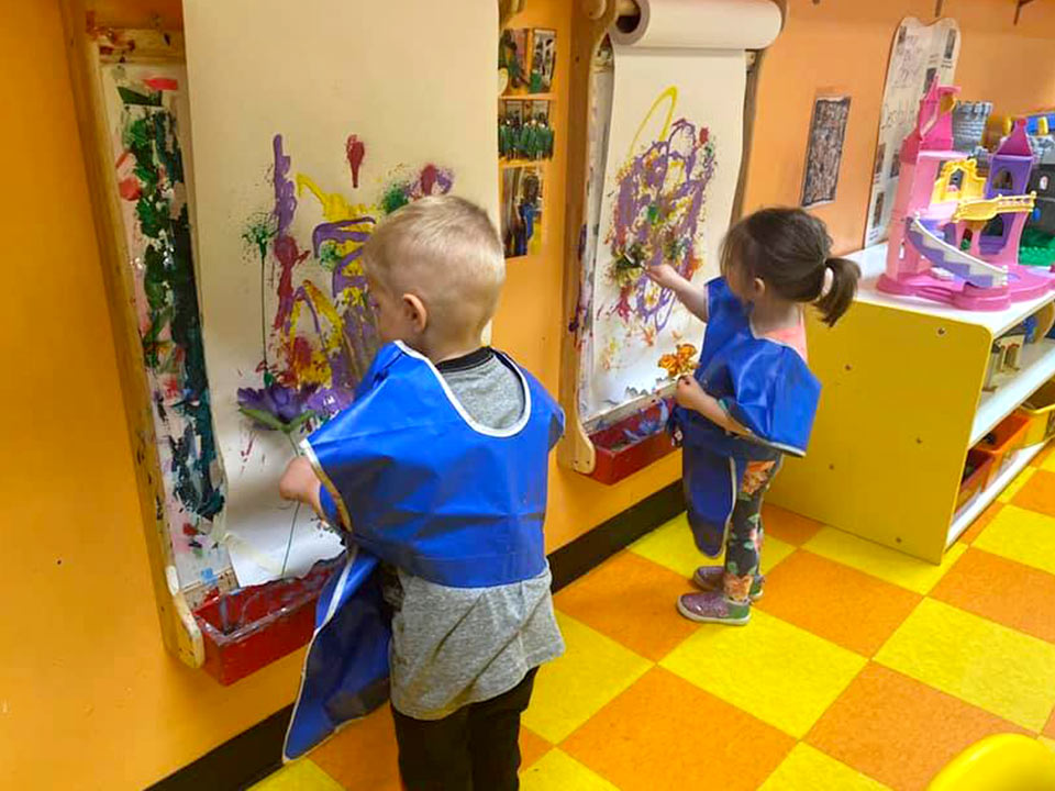 Boy and girl painting at Robin's Nest Learning Center in Marion, Illinois