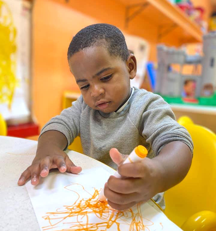 Boy coloring at Robin's Nest Learning Center in Marion, Illinois