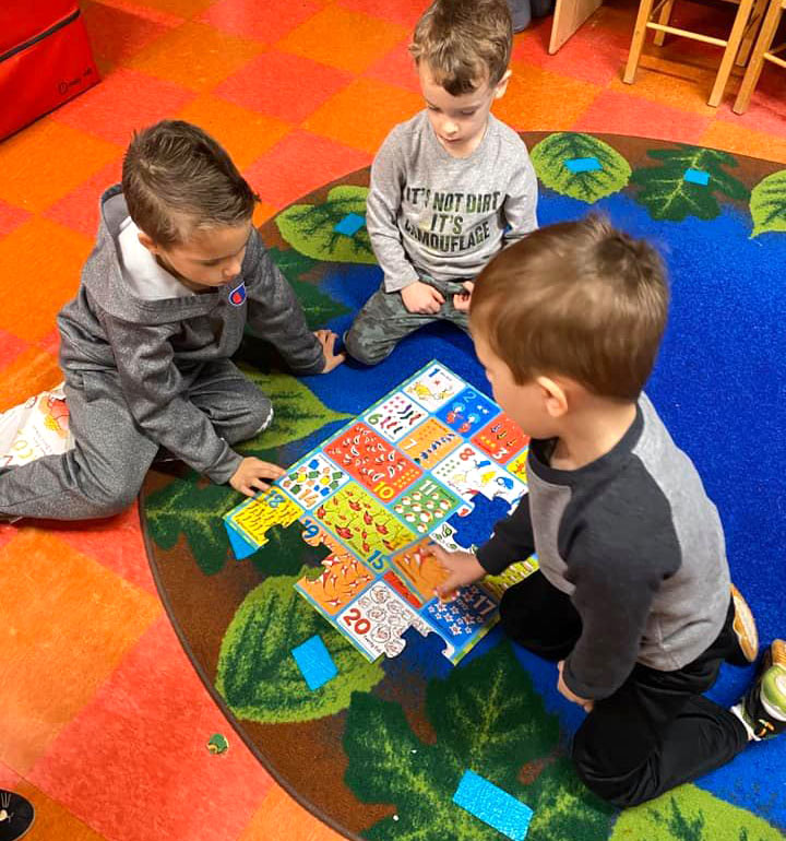 Boys playing with puzzel at Robin's Nest Learning Center in Marion, Illinois