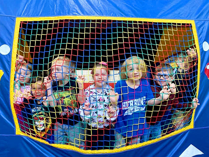 Kids playing in Bounce House Party Rental Space in Carterville, Illinois at Robin's Nest Learning Center