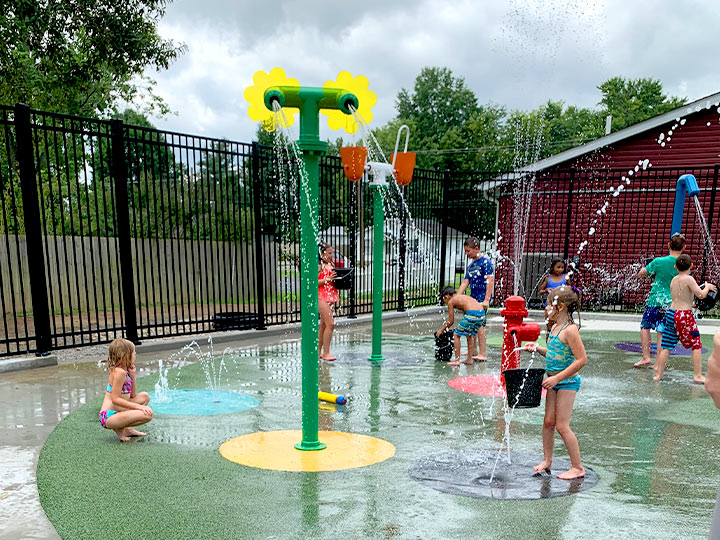 Kids playing at Splash Pad Party Rental Space in Carterville, Illinois at Robin's Nest Learning Center