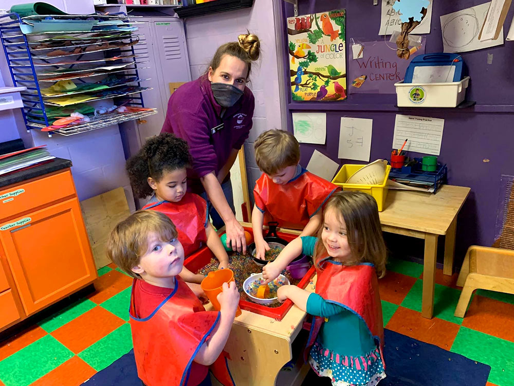 PreSchool - Teacher with students at Robins Nest Learning Center