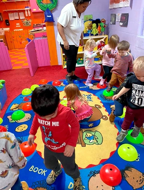 PreSchool - Teacher with students at Robins Nest Learning Center