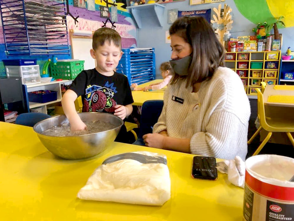 Kindergardener and teacher at Robins Nest Learning Center at Robins Nest Learning Center