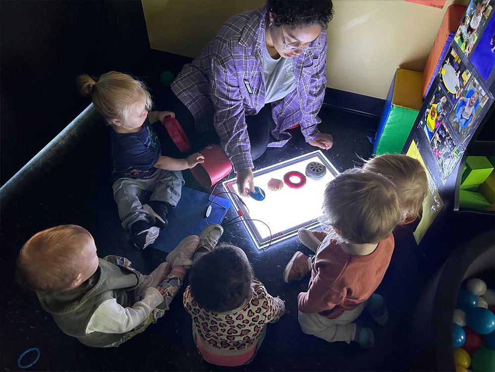 Pre-K Advanced - Student with teacher at Robins Nest Learning Center