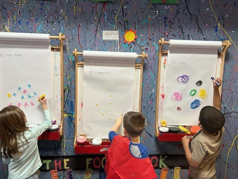 Pre-K Advanced - Kids drawing at Robins Nest Learning Center