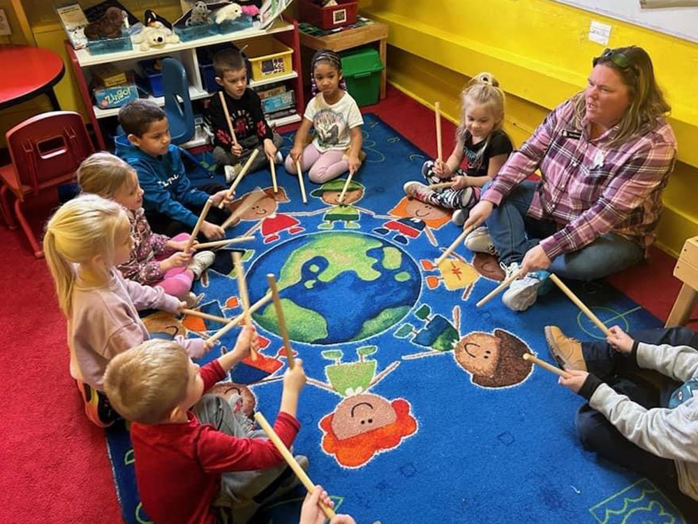 Pre-K Advanced - Teacher and students on Valentives Day at Robins Nest Learning Center