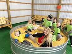 Pre-K Advanced - Playing in tub of corn