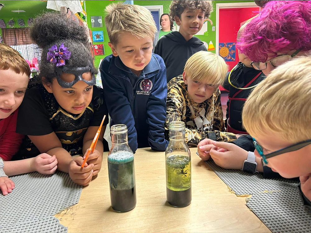 School-Aged - Students with groundhog at Robins Nest Learning Center