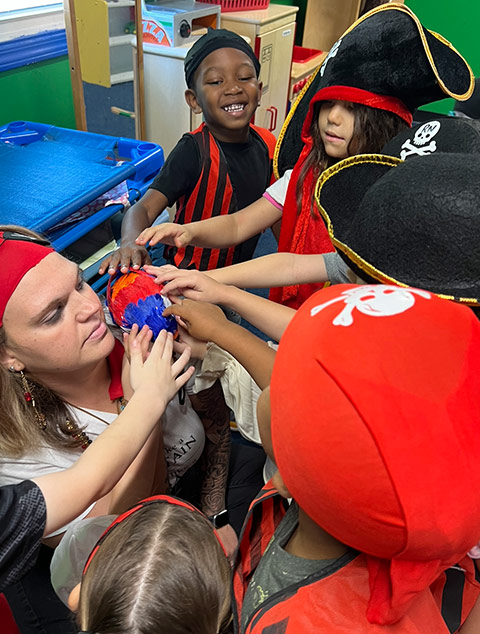 School-Aged - Teacher with students at Robins Nest Learning Center