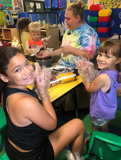 School-Aged - Student with mask at Robins Nest Learning Center