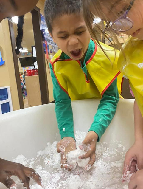 School-Aged - Students painting at Robins Nest Learning Center