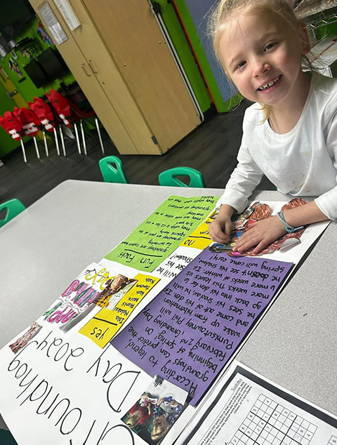 School-Aged - Students writing at Robins Nest Learning Center