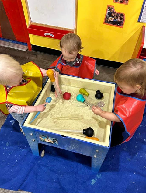 PreSchool - Teacher with students at Robins Nest Learning Center