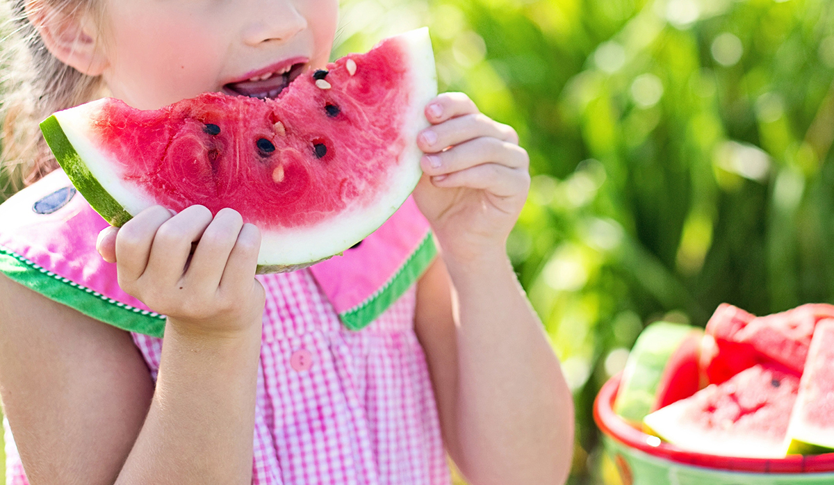 Girl eating watermelon - Robin's Nest 2023 Summer Camp Healthy YOU